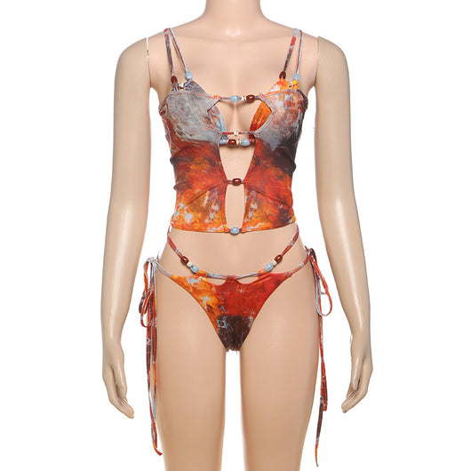 Women's fashionable three-piece bikini set with an abstract orange, brown, and blue print. Features a triangle top, mesh mini skirt, and lace-up details with be - Image 21