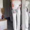 Jumpsuit Blanco Elegante con Hombros Descubiertos y Detalles en Plumas