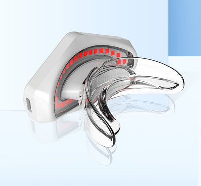 White and clear plastic beauty lip care instrument with red light elements for at-home lip treatment. - Image 16