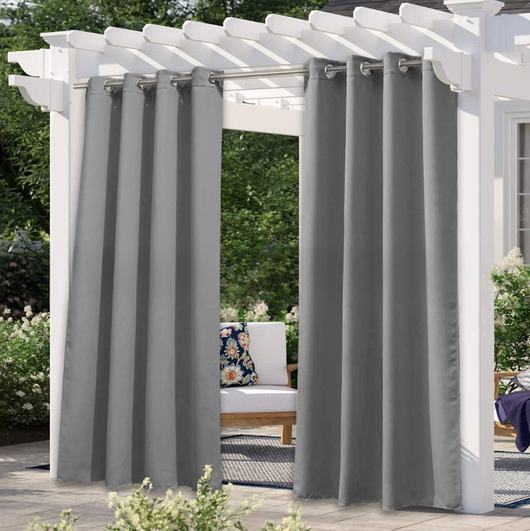 Solid gray outdoor curtain panels with grommet tops hanging from a white pergola on a sunny patio. - Image 4
