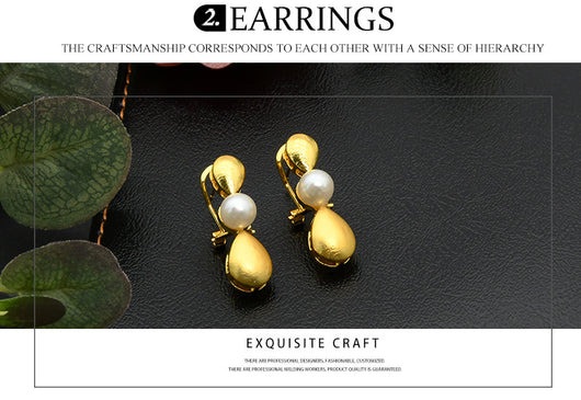 Women's four-piece jewelry set with matte gold teardrop links and white pearls, including a necklace, earrings, ring, and bracelet. - Image 9