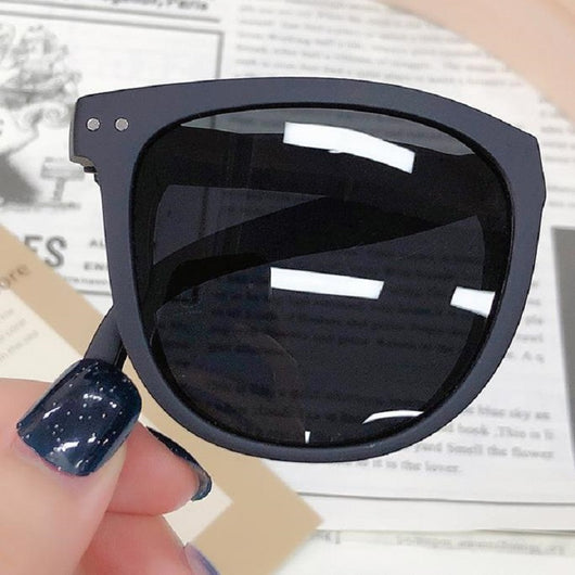 Light brown foldable women's sunglasses with round frames and brown polarized lenses on a white background. - Image 20