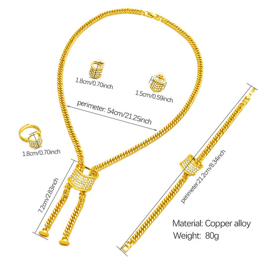 Gold-plated four-piece jewelry set with teardrop rhinestone necklace, bracelet, earrings, and ring on red velvet stands. - Image 8