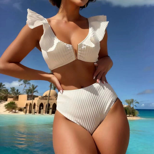 White ribbed bikini with ruffled shoulder straps and high-waisted bottoms on a model at a tropical beach. - Image 3