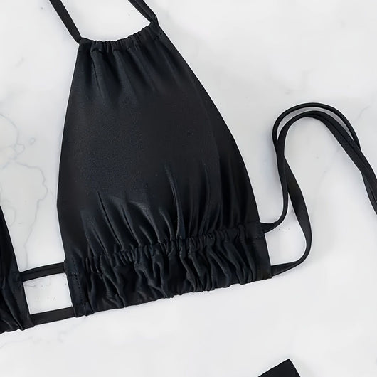 Women's black deep V push-up bikini with lace-up back and high-waisted bottom, laid flat on white marble. - Image 3