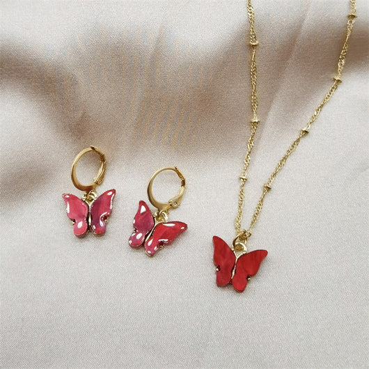 Pink acrylic butterfly necklace and earring set with gold-colored chain and hoop earrings. - Image 14