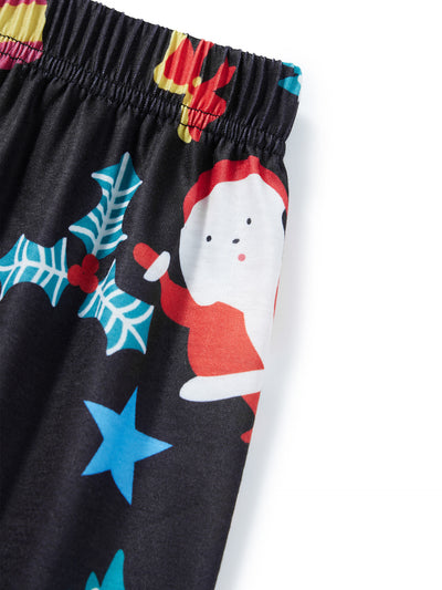 Man wearing a black and red long-sleeve Christmas pajama set with "Merry Christmas" graphic and Santa print pants. - Image 23