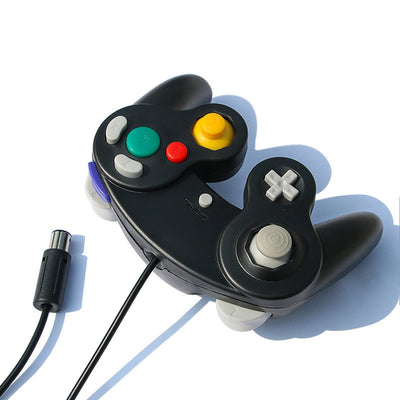 Orange wired gamepad with a USB connector, featuring a D-pad, joystick, and colored action buttons. - Image 4