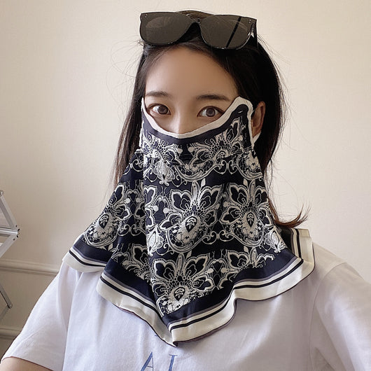 Female cream and black floral polka dot sun protection mask with ear loops, designed for eye corner protection. - Image 20