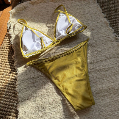 Woman wearing a black sequined triangle bikini top and high-cut bottom on a sunny beach. - Image 24