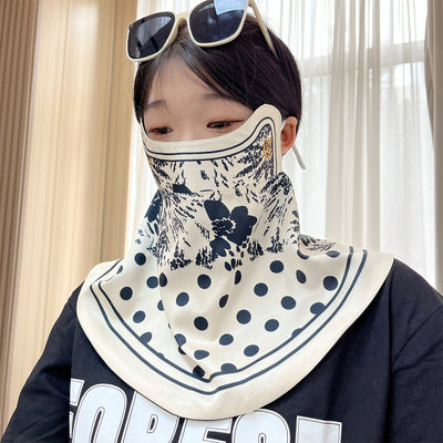 Female cream and black floral polka dot sun protection mask with ear loops, designed for eye corner protection. - Image 22