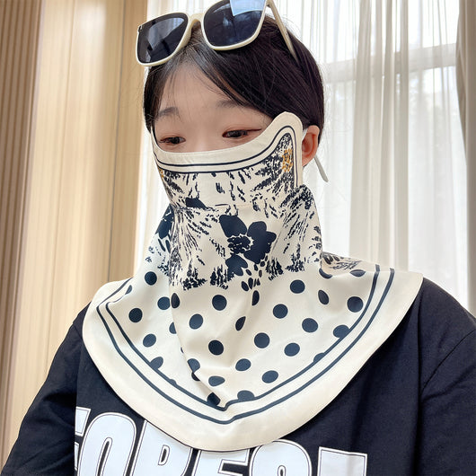 Female cream and black floral polka dot sun protection mask with ear loops, designed for eye corner protection. - Image 22