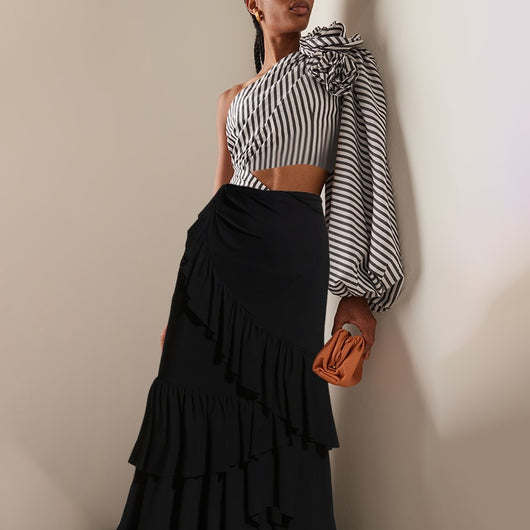 Black and white striped one-piece swimsuit with one-shoulder design, floral appliqué, balloon sleeve, and waist cut-outs. - Image 8
