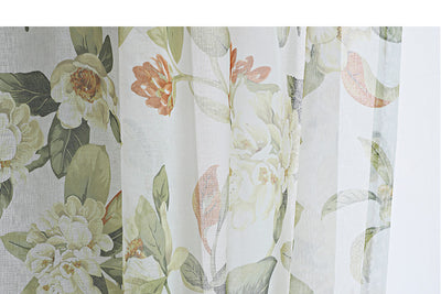 Dark gray semi-sheer curtains with a white and green floral pattern, hung on a black rod in a living room. - Image 12