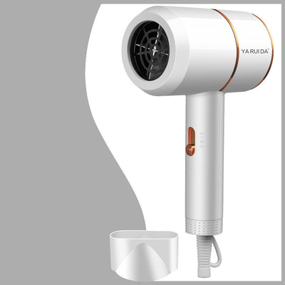 White portable folding hair dryer with rose gold accents and a nozzle attachment, shown with its base. - Image 16