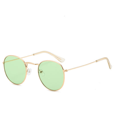 Round gold-framed sunglasses with pink tinted lenses, featuring clear temple tips. - Image 8