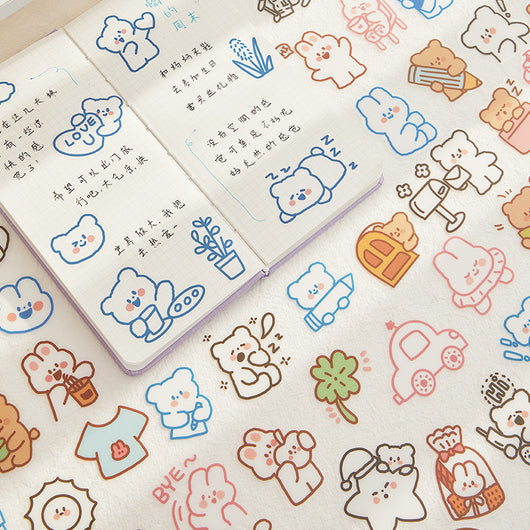 40-piece pack of cute white bunny PET stickers with pink outlines, showing the bunny in various activities like driving, fishing, and holding flowers, on a pink