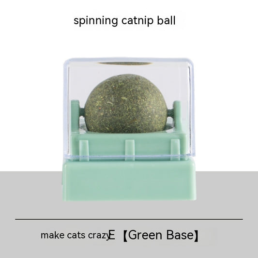Two spinning catnip balls, one with a green base and one with a blue base, in clear plastic cases. - Image 2