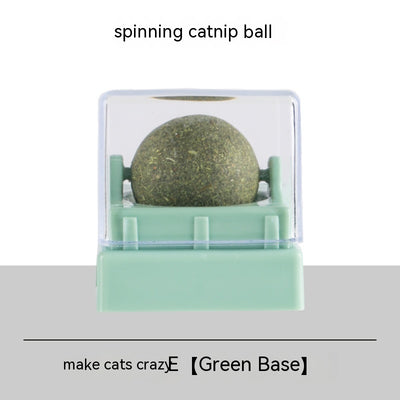 Two spinning catnip balls, one with a green base and one with a blue base, in clear plastic cases. - Image 2