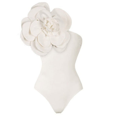 Black one-piece swimsuit with a large 3D flower on one shoulder and a geometric pattern on the bodice. - Image 14