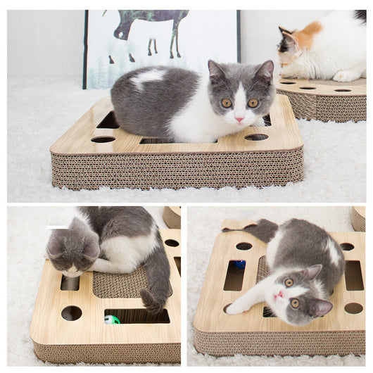 Round corrugated cardboard cat scratcher with a central scratching pad and multiple holes containing colorful balls. - Image 3