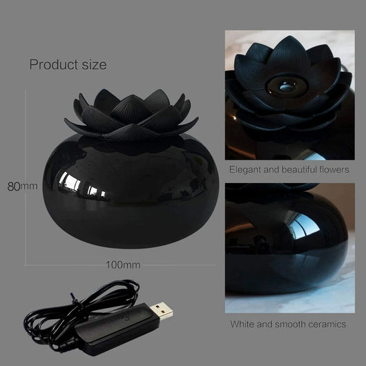 Black spherical aromatherapy humidifier with a lotus flower top, emitting mist, sitting on a gold decorative doily. - Image 9