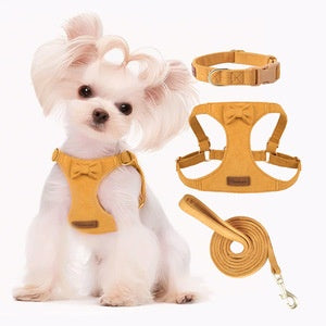 Orange and gray pet harness made of Oxford cloth with reflective trim, a top handle, and adjustable straps. - Image 19