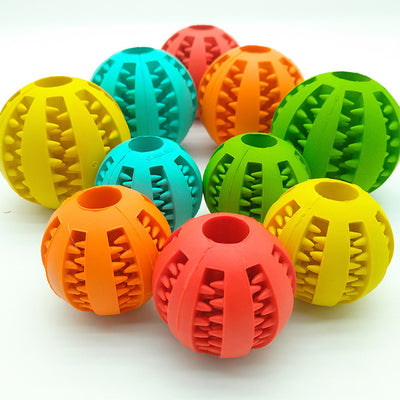 Teal rubber slow feeder dog toy ball with internal spikes for teeth cleaning and treat dispensing, 7cm size. - Image 4