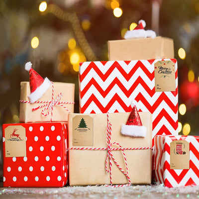 Kraft paper Christmas holiday gift sticker roll with various designs including reindeer, Christmas trees, and Merry Christmas text. - Image 4