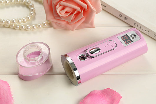 White and rose gold nano spray water meter with a clear tank, digital display, and power button. - Image 16