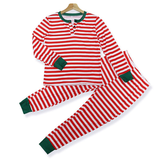 Family of four wearing matching red and white striped Christmas pajamas with green cuffs. One child wears a Santa hat, another wears reindeer antlers. - Image 18