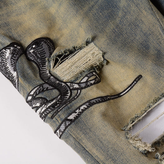 Jeans Slim Fit Desgastados con Bordado de Serpiente de Tres Cabezas y Parches de Cuero - Image 13