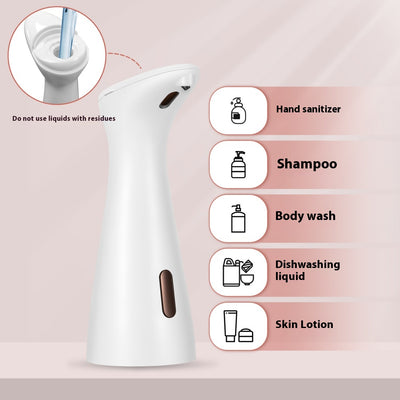 White automatic soap dispenser with an infrared sensor, dispensing blue liquid soap onto an outstretched hand. - Image 10