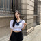 Conjunto Dos Piezas: Blusa Ajustada y Falda Midi Reductora