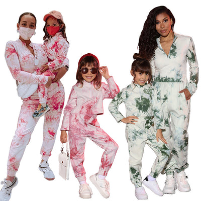 Mother and daughter wearing matching white, green, and blue tie-dye long-sleeved sweater and jogger sets. - Image 4