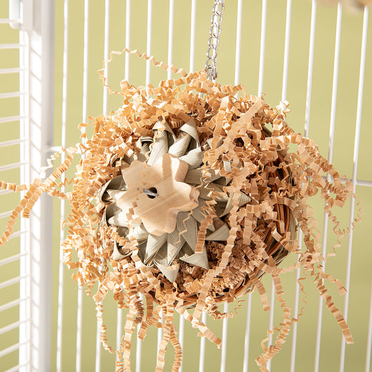Colorful parrot bird toy with a woven basket base, braided chew sticks, crinkled paper, and a metal hanging chain. - Image 15