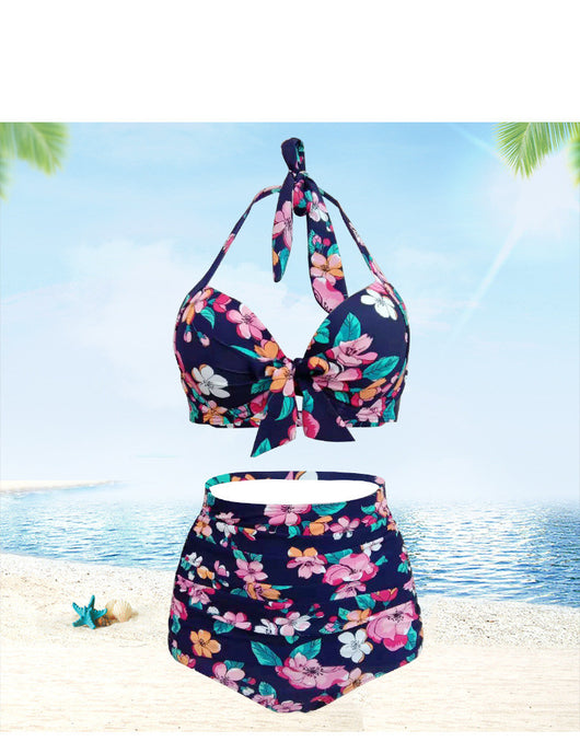 Navy blue floral high-waisted bikini with a halter top and front tie knot, featuring pink, orange, and white flowers. - Image 12