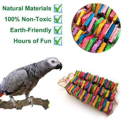 Colorful parrot gnawing toy with stacked cardboard blocks in red, green, yellow, blue, and pink, hanging from a rope. - Image 3
