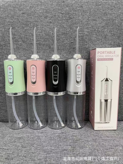 Four portable electric water flossers in green, pink, black, and silver, with clear water tanks, displayed next to their box. - Image 14