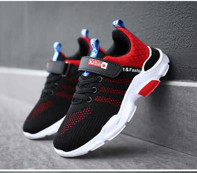 Boy's black and blue sports shoes with orange accents, mesh upper, white sole, blue laces, and a Velcro strap. - Image 15