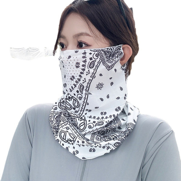 Black paisley sun mask with white pattern and ear loops, covering the lower face and neck, worn outdoors. - Image 5