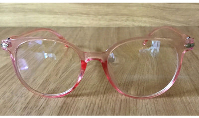 Pink round-frame anti-blue light glasses with clear lenses and small silver accents on the temples. - Image 13