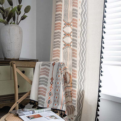 Boho cream cotton and linen curtain with tribal print in black and orange, featuring black fringe tassels. - Image 2