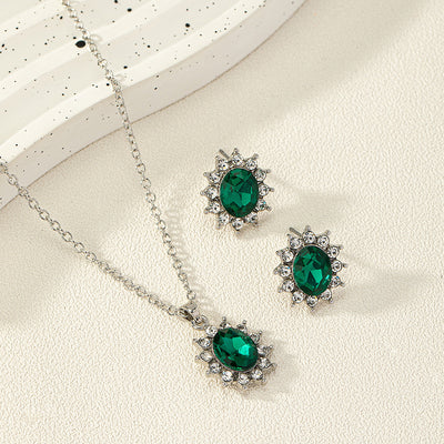 Iridescent teardrop pendant necklace with matching stud earrings, featuring clear accent stones and silver-tone metal. - Image 2