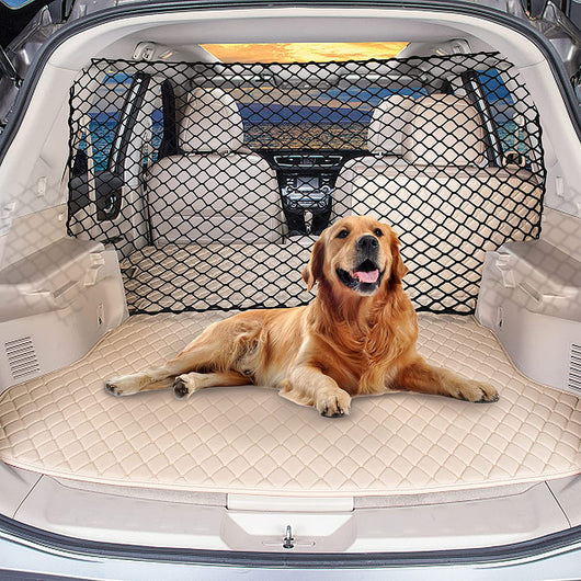 Black mesh dog protective net installed in a silver hatchback trunk, separating a golden retriever from the front seats.