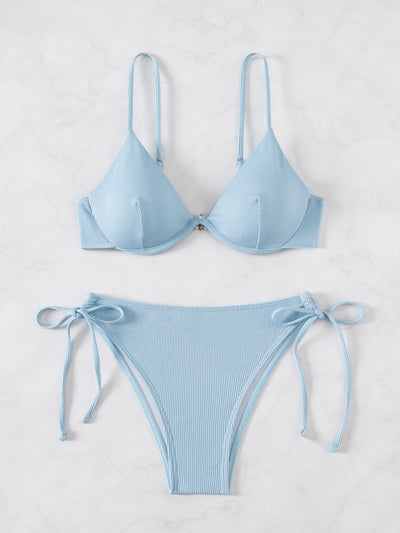 Black ribbed two-piece bikini with an underwire top and tie-side bottoms on a white marble surface. - Image 14