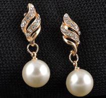 Gold-tone necklace and dangle earring set with faux pearls and clear rhinestones, displayed on a black bust. - Image 4