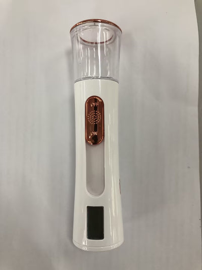 White and rose gold double-spraying nano mist sprayer with a clear reservoir, next to its product box and USB cable. - Image 12