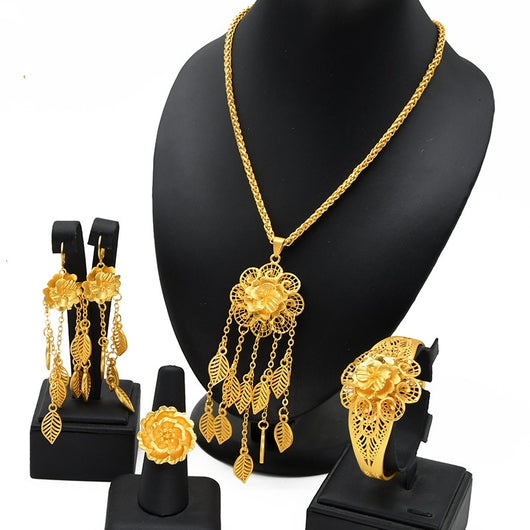 Gold-plated jewelry set with filigree flower designs, including a necklace with dangling chains, matching earrings, a ring, and a bracelet. - Image 6