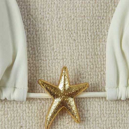 White women's bikini with triangle top and tie-side bottom, featuring a gold starfish charm on the center front. - Image 4